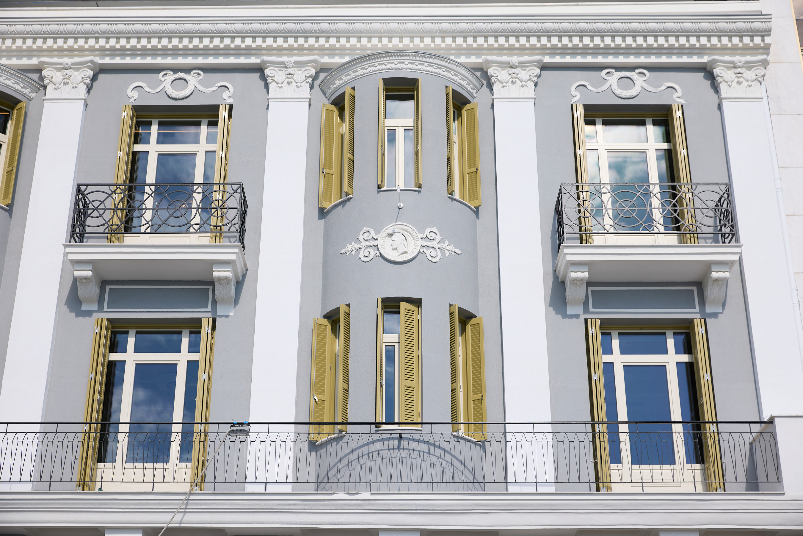 
ON Residence Hotel exterior with neoclassical design, ornate balconies and classic windows 