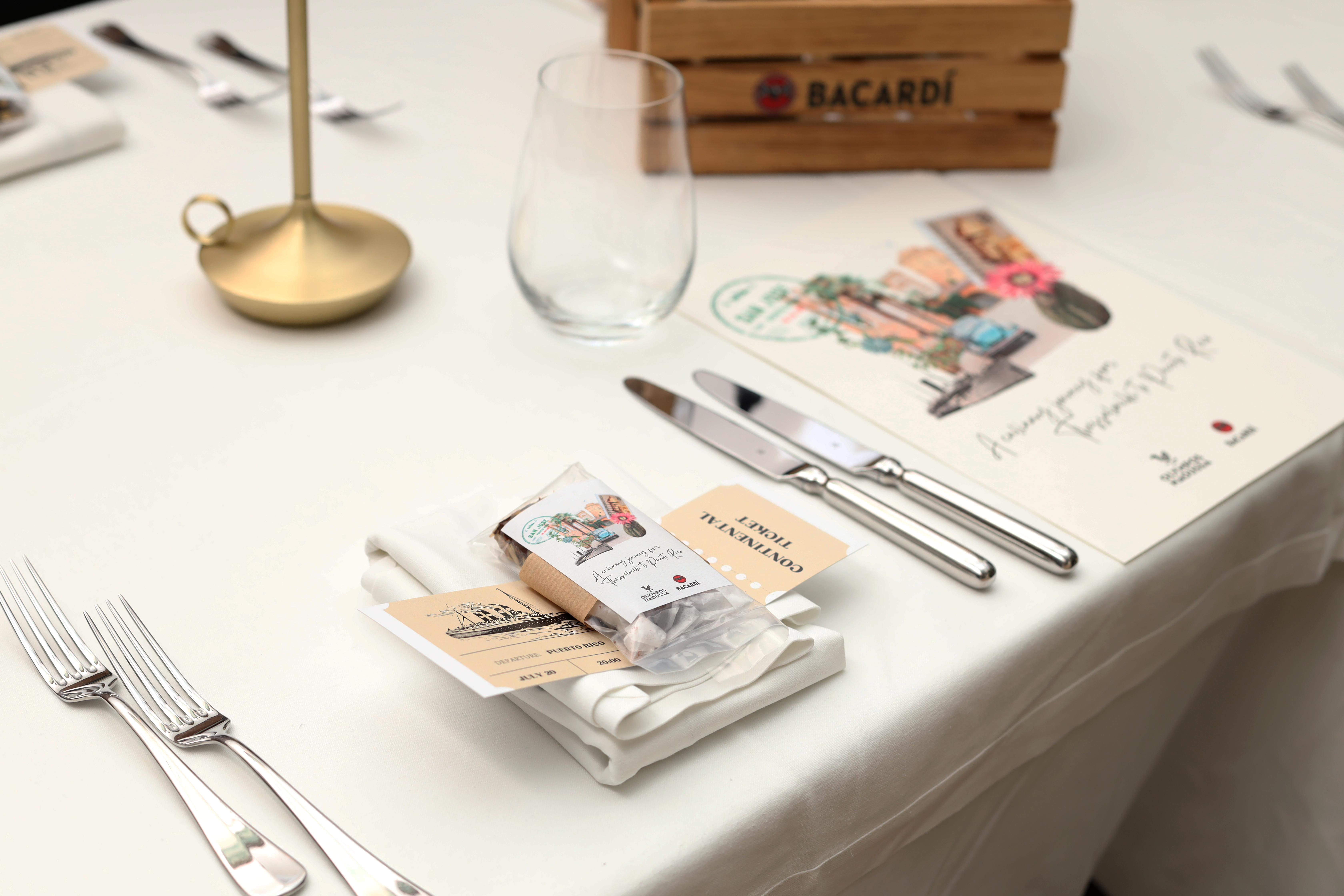 
Elegant table setup with menu, cutlery, and welcome gift at ON Residence Hotel
