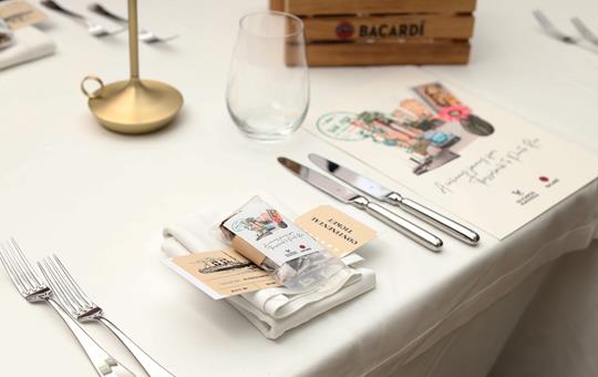 Elegant table setup with menu, cutlery, and welcome gift at ON Residence Hotel