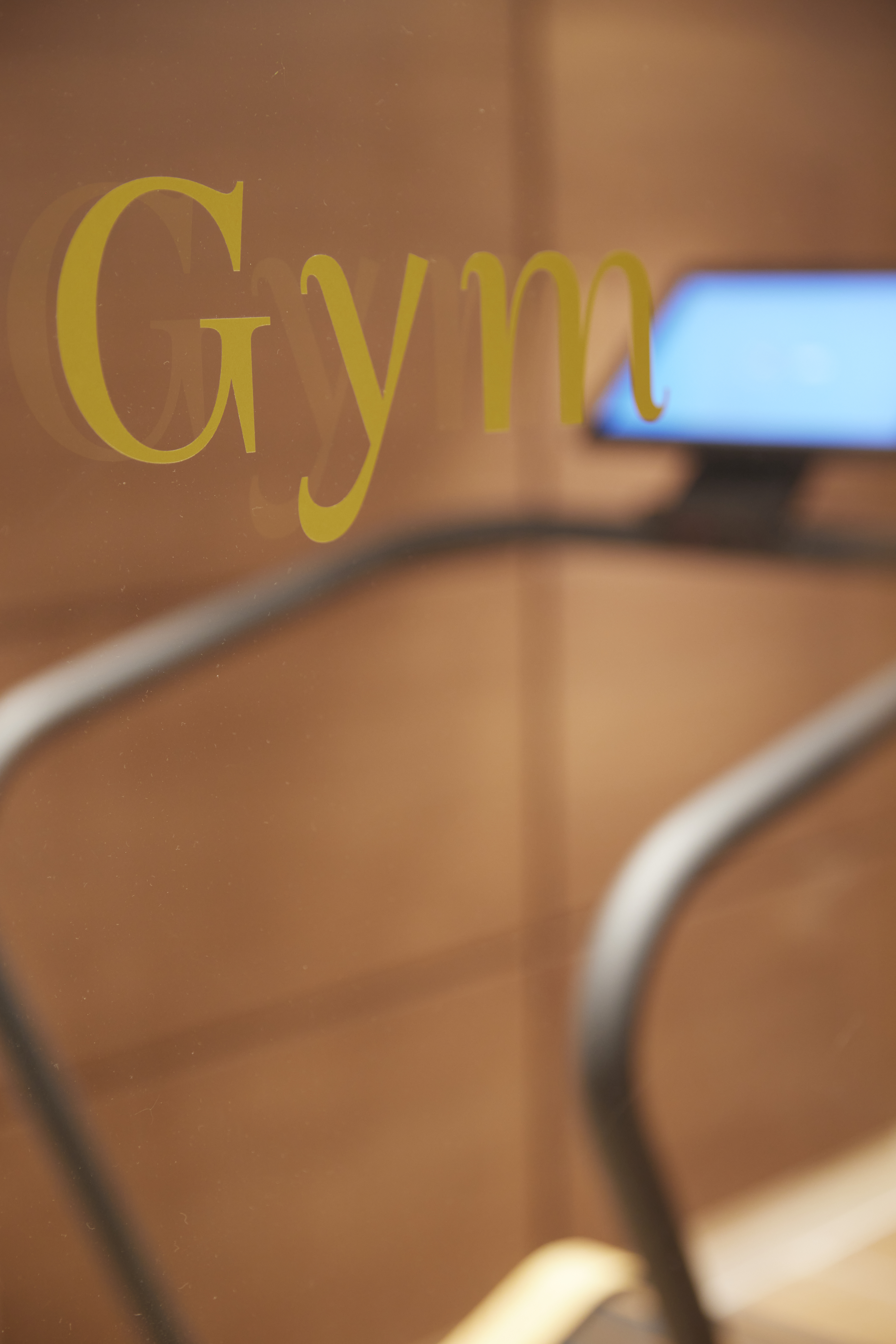 
Entrance detail of the fitness room with glass door inscription at ON Residence Hotel