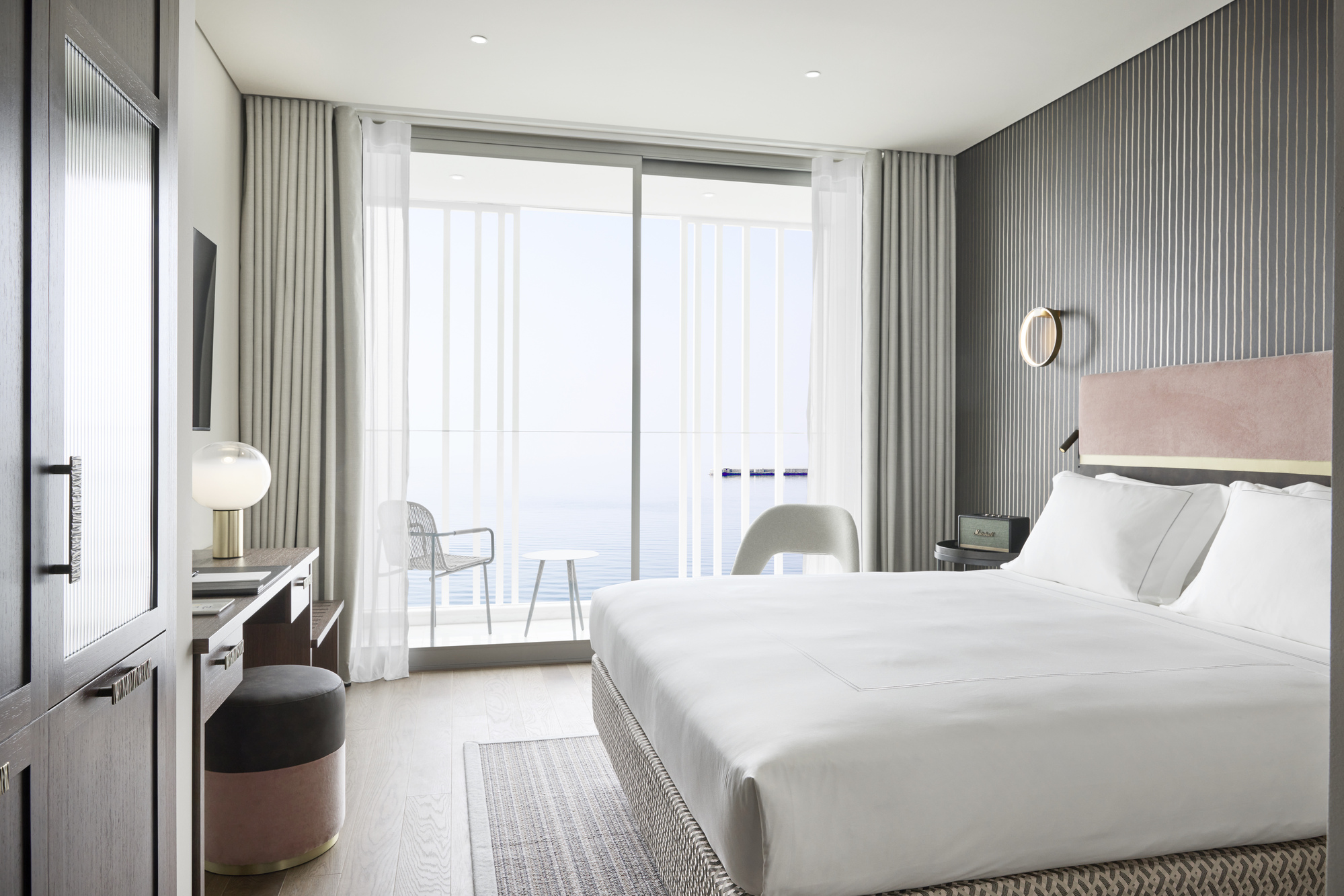 
Deluxe seafront room with king bed, desk, balcony seating and panoramic sea view at ON Residence Hotel