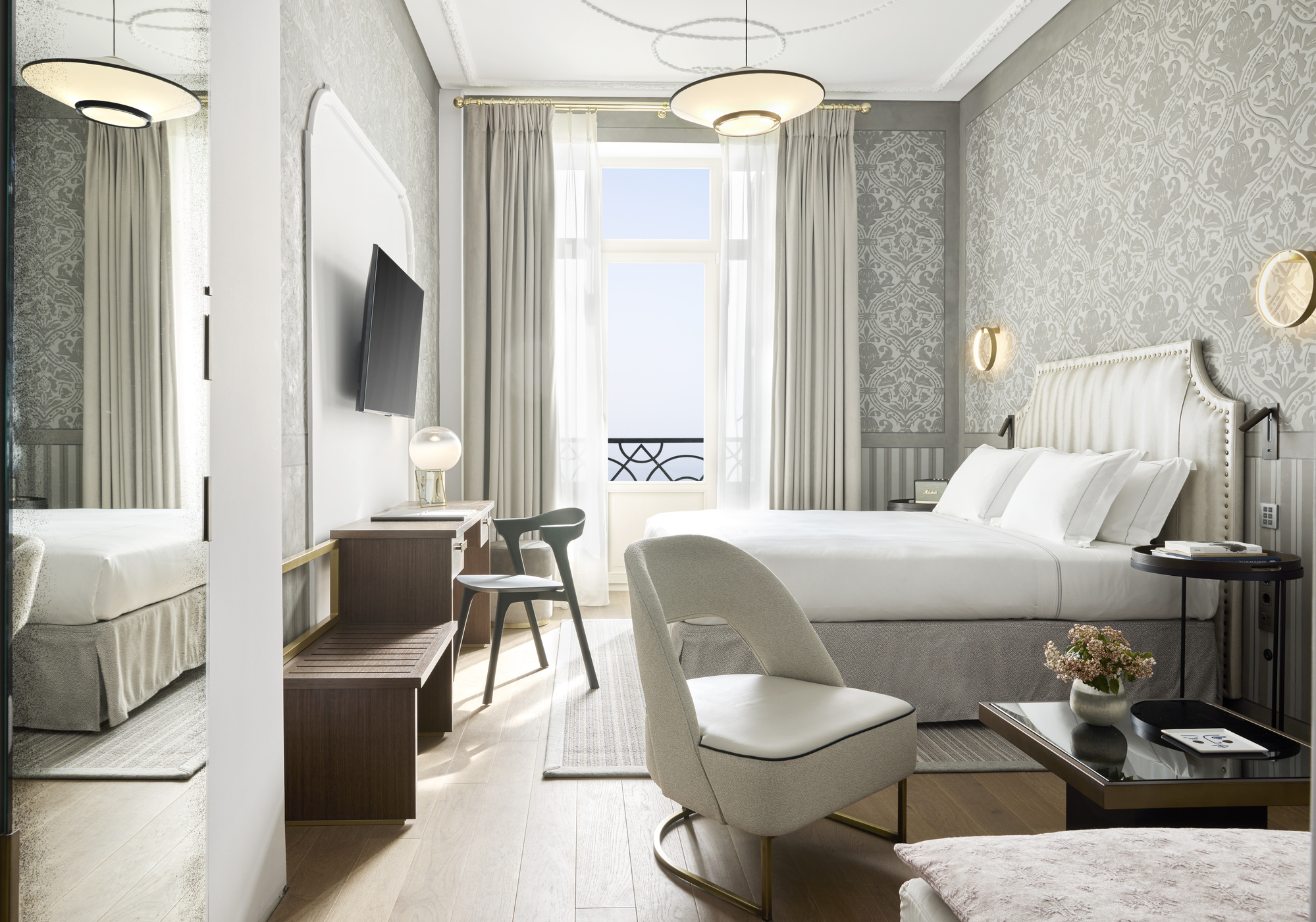 
Junior suite seafront with balcony, elegant bed, seating area, desk and sea view at ON Residence Hotel