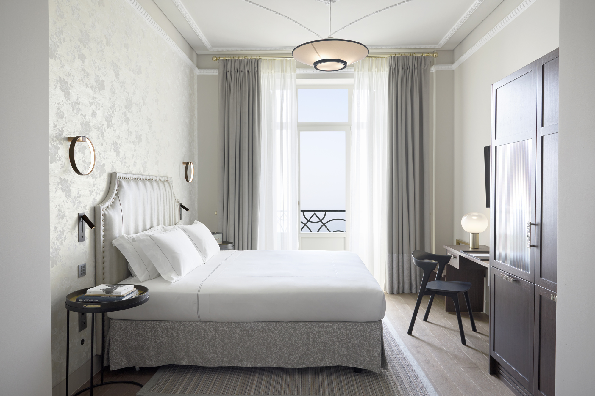 
Junior suite seafront with king bed, balcony access, modern desk and elegant decor at ON Residence Hotel