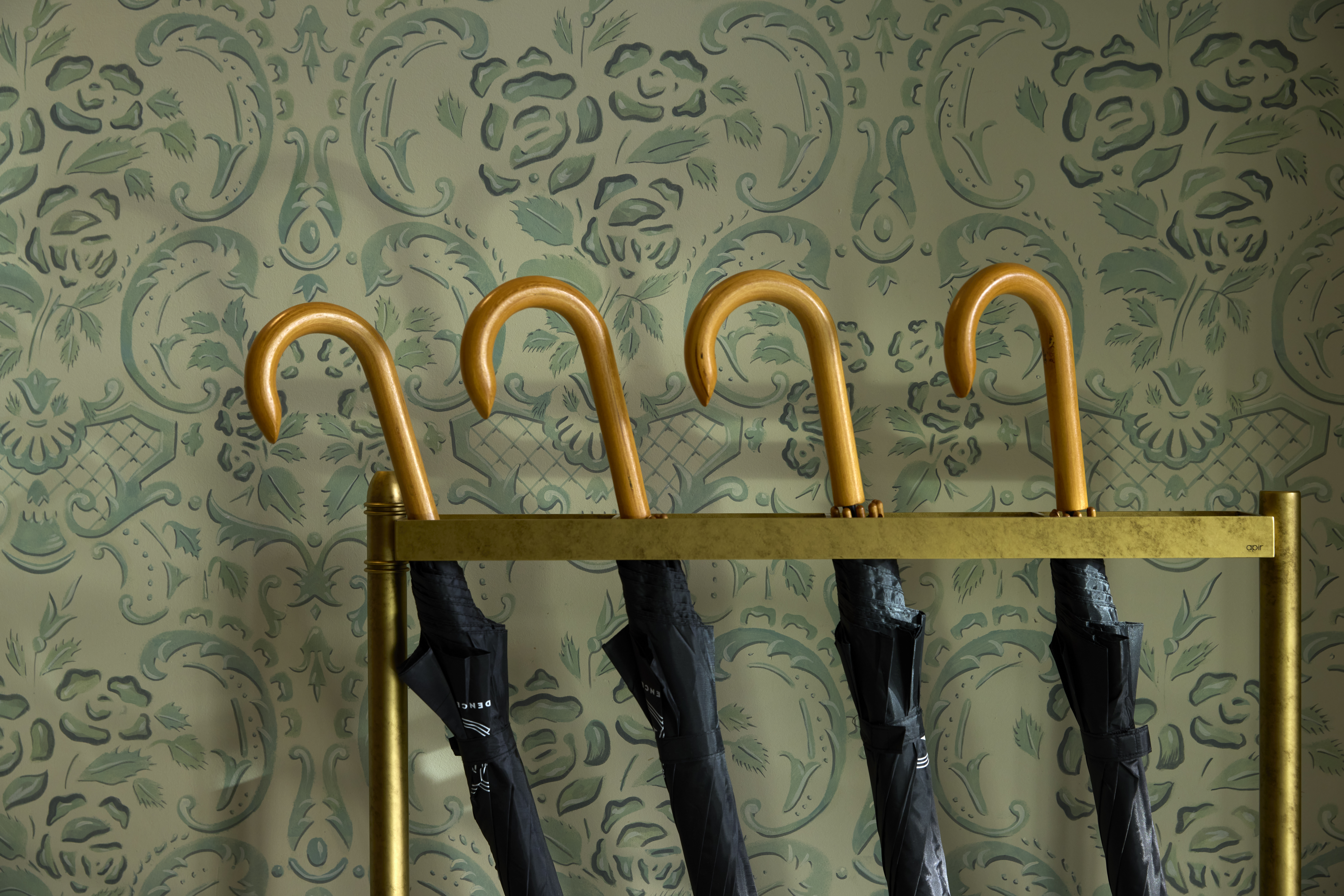 
Elegant ON Residence Hotel lobby corner with vintage gold umbrella holder